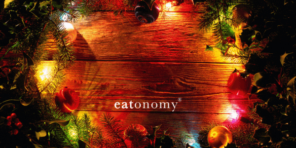 A Christmas wreath and lights surrounding the words "Season's Meeting's".